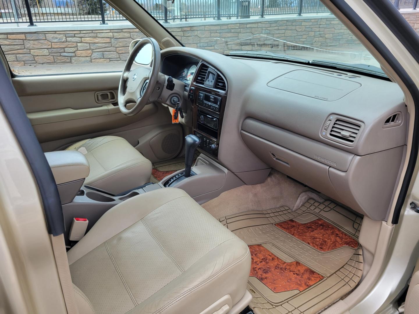 2002 Gold /Tan Nissan Pathfinder LE (JN8DR09Y22W) with an 3.5L v6 engine, Automatic transmission, located at 450 N Russell, Missoula, MT, 59801, (406) 543-6600, 46.874496, -114.017433 - 4WD SUV. 3.5L V6. Automatic Transmission. Heated Seats. Power Leather Seats. Power Sunroof. Air. Cruise. Tilt. AM FM CD Player. Power Windows and Locks. Because of the age, Financing is not available on this vehicle. - Photo#9